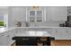 Bright kitchen with white cabinets and an island, offering plenty of countertop space at 1294 Parkview Nw Ln, Kennesaw, GA 30152