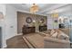 Elegant living room with hardwood floors, a mirrored wall, and classic furnishings at 1294 Parkview Nw Ln, Kennesaw, GA 30152