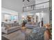 Bright and open living room showcasing hardwood floors, comfortable seating, and an adjacent kitchen at 1294 Parkview Nw Ln, Kennesaw, GA 30152