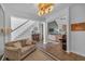 Cozy living room area with hardwood floors, stairway, and comfortable seating at 1294 Parkview Nw Ln, Kennesaw, GA 30152