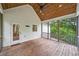 Cozy screened-in back porch with wood ceiling and floors, plus ceiling fan at 210 Joe Green Ln, Canton, GA 30114