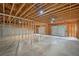 An unfinished basement with exposed wood and concrete floors at 210 Joe Green Ln, Canton, GA 30114