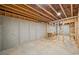 An unfinished basement with concrete walls and floors at 210 Joe Green Ln, Canton, GA 30114