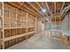 Unfinished basement features framed walls, exposed insulation, and shelving at 210 Joe Green Ln, Canton, GA 30114