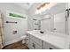 Modern bathroom with vanity, mirror, lighting, and shower/tub combo at 210 Joe Green Ln, Canton, GA 30114