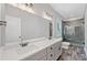 Bathroom featuring double sink vanity, modern fixtures, and a glass enclosed shower at 210 Joe Green Ln, Canton, GA 30114