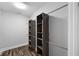 Walk in closet features built-in shelving with wood-look flooring at 210 Joe Green Ln, Canton, GA 30114