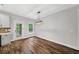 Bright dining area featuring hardwood floors and views of the backyard and screen porch at 210 Joe Green Ln, Canton, GA 30114