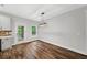 Dining area with modern light fixture, wood floors and backyard views at 210 Joe Green Ln, Canton, GA 30114