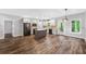 Modern kitchen features stainless appliances, a center island and a brick backsplash at 210 Joe Green Ln, Canton, GA 30114