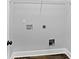 Laundry room offers washer and dryer hookups with a wire shelf for storage at 210 Joe Green Ln, Canton, GA 30114