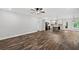 The living room flows into the kitchen with stainless appliances, island, and hardwood floors at 210 Joe Green Ln, Canton, GA 30114