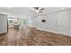 The living room flows into the kitchen with stainless appliances, island, and hardwood floors at 210 Joe Green Ln, Canton, GA 30114