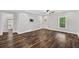 Neutral living room features hard wood floors, a ceiling fan and television mount at 210 Joe Green Ln, Canton, GA 30114