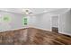 Bright living room featuring wood-look floors, and a white-framed window offering natural light at 210 Joe Green Ln, Canton, GA 30114