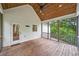 Lovely screened porch with beautiful wood flooring, ceiling and an outdoor ceiling fan at 210 Joe Green Ln, Canton, GA 30114