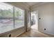 Bright bedroom featuring hardwood floors, large window and access to outdoor balcony at 2110 River Green Nw Dr # 2110, Atlanta, GA 30327