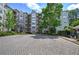 Exterior view of well-maintained condominium building with lush landscaping at 2110 River Green Nw Dr # 2110, Atlanta, GA 30327