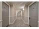 Condo hallway featuring neutral decor, carpet, and unit entry doors at 2110 River Green Nw Dr # 2110, Atlanta, GA 30327