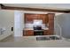 Kitchen featuring dark cabinets and stainless steel appliances seen from the counter at 2110 River Green Nw Dr # 2110, Atlanta, GA 30327
