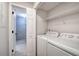 Convenient laundry area near the bathroom with washer and dryer at 2110 River Green Nw Dr # 2110, Atlanta, GA 30327
