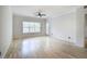 Spacious living room featuring hardwood floors, neutral walls, and a glass door at 2110 River Green Nw Dr # 2110, Atlanta, GA 30327