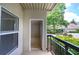 Condo patio showing outdoor living space with lush greenery and building views at 2110 River Green Nw Dr # 2110, Atlanta, GA 30327