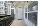 A cozy outdoor patio with black railing and storage closet at 2110 River Green Nw Dr # 2110, Atlanta, GA 30327