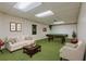 Finished basement with plush carpet, pool table, and plenty of space for entertaining at 6825 Castleton Dr, Atlanta, GA 30328