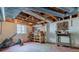 Unfinished basement workshop with exposed beams and ample space for projects at 6825 Castleton Dr, Atlanta, GA 30328