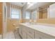 Vintage bathroom featuring yellow tile, a white vanity with a large mirror, and classic fixtures for a retro charm at 6825 Castleton Dr, Atlanta, GA 30328
