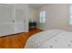 Well-lit bedroom with hardwood floors, a closet, and great natural light at 6825 Castleton Dr, Atlanta, GA 30328