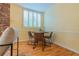 Cozy dining area with hardwood floors, shuttered window and seating for four at 6825 Castleton Dr, Atlanta, GA 30328
