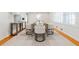 Elegant dining area with modern chairs, stylish decor, and natural light from shuttered windows at 6825 Castleton Dr, Atlanta, GA 30328