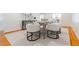 Neutral dining area offering hardwood floors, white walls and modern neutral furniture at 6825 Castleton Dr, Atlanta, GA 30328