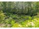 Expansive backyard featuring lush gardens, stone paths, and mature trees at 6825 Castleton Dr, Atlanta, GA 30328