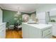 Traditional eat-in kitchen with a center island, hardwood floors, and lots of cabinets at 6825 Castleton Dr, Atlanta, GA 30328