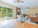 Bright living room with hardwood floors, sliding glass doors, a brick fireplace, and comfortable seating for relaxation at 6825 Castleton Dr, Atlanta, GA 30328