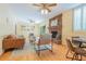 Bright living room with brick fireplace, hardwood floors, built-in shelving and sliding glass doors at 6825 Castleton Dr, Atlanta, GA 30328