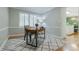Bright home office with a modern desk, comfortable chair, and stylish rug creates an inviting workspace at 6825 Castleton Dr, Atlanta, GA 30328