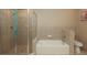 Well-maintained bathroom with a walk-in shower and separate bathtub at 711 Cosmopolitan Ne Dr # 338, Atlanta, GA 30324