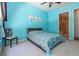 Cozy bedroom with blue walls and a large window at 711 Cosmopolitan Ne Dr # 338, Atlanta, GA 30324