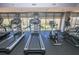 Treadmills and exercise bikes overlooking the outdoor pool at 711 Cosmopolitan Ne Dr # 338, Atlanta, GA 30324