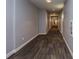 Long hallway with patterned flooring and recessed lighting at 711 Cosmopolitan Ne Dr # 338, Atlanta, GA 30324