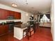 Modern kitchen with dark wood cabinets and a granite countertop island at 711 Cosmopolitan Ne Dr # 338, Atlanta, GA 30324