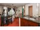 Open kitchen and dining area with granite countertops and views into the living room at 711 Cosmopolitan Ne Dr # 338, Atlanta, GA 30324