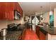 Modern kitchen with granite countertops and stainless steel appliances flows into the dining and living area at 711 Cosmopolitan Ne Dr # 338, Atlanta, GA 30324