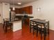 Stylish kitchen with granite island, stainless appliances, and hardwood floors at 711 Cosmopolitan Ne Dr # 338, Atlanta, GA 30324