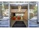 A grand lobby with high ceilings, a modern chandelier, and a cozy seating area creates a welcoming atmosphere at 711 Cosmopolitan Ne Dr # 338, Atlanta, GA 30324