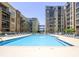 An inviting community pool offers a refreshing escape with ample lounge space and building views at 711 Cosmopolitan Ne Dr # 338, Atlanta, GA 30324
